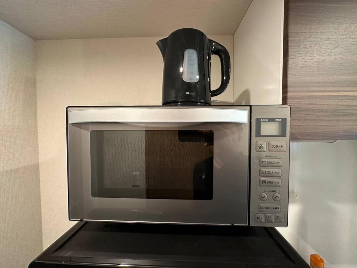 Apartment 上野駅徒歩５分シングルベッド４台+ソファベッド２台 1ldk *