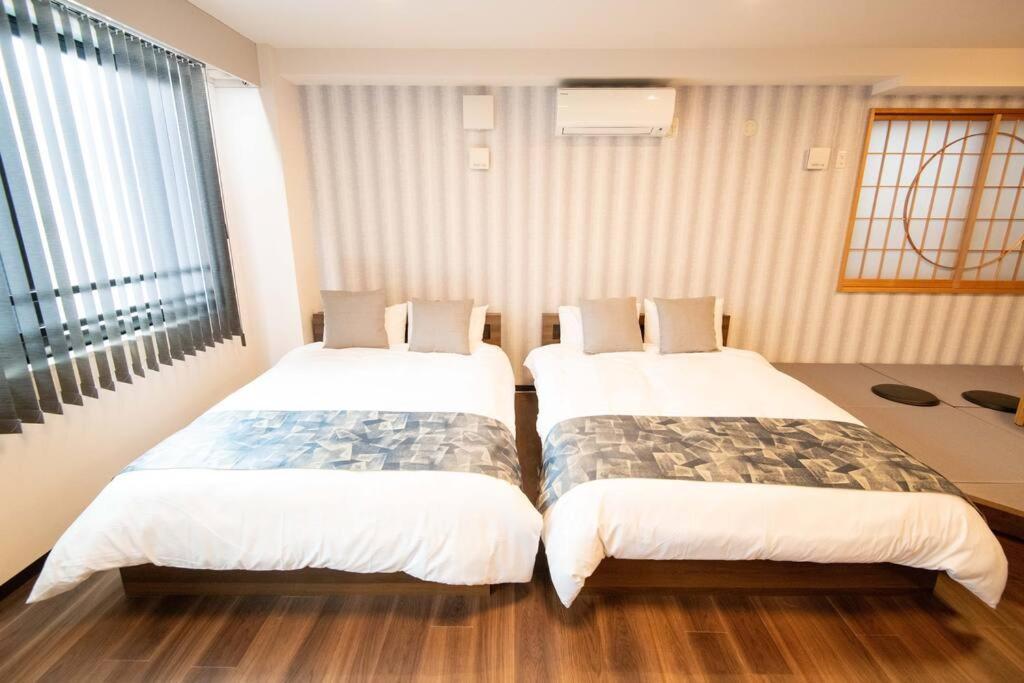 Apartment 浅草禅心居301室 浅草駅徒歩15分 2024年4月ニューオープン 43平米丸貸し切り ダブルベット2台と畳敷き布団2組 家庭式用品設備完備 *